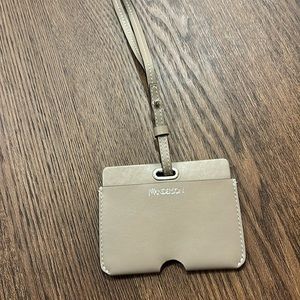 JW Anderson beige leather card holder with lanyard.